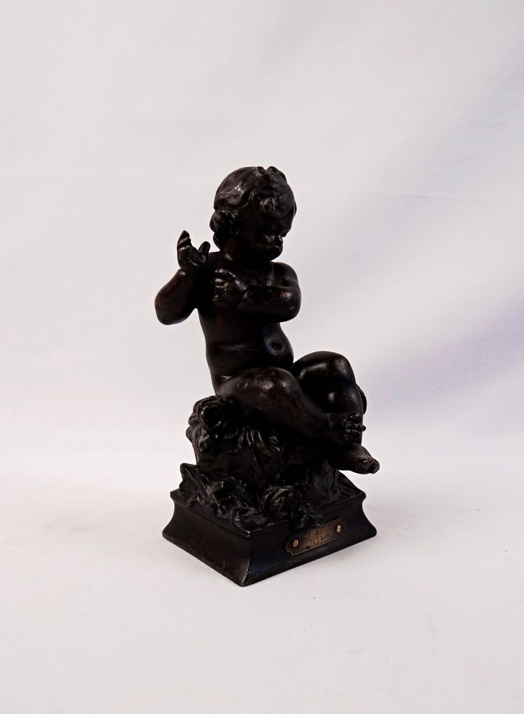 "The Child and the Lizard," a statuette in regul, with a brown patina, signed by Hyppolite Moreau, 19th century
