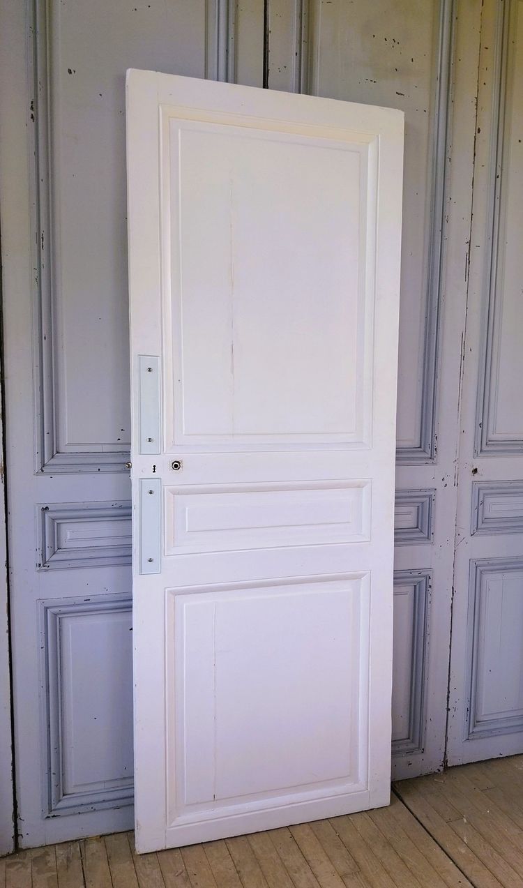 Historic Haussmann-style door with its original frame