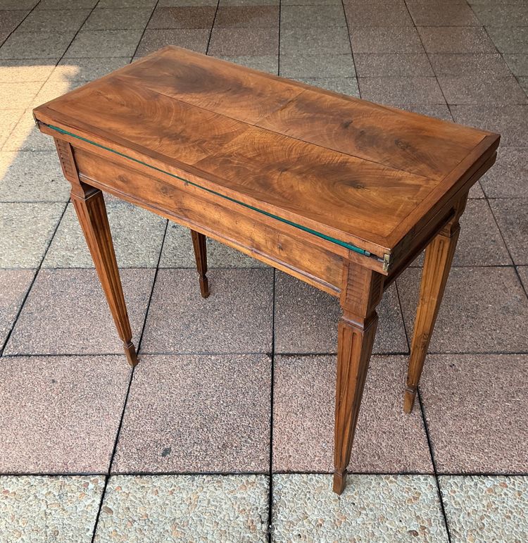 A Louis XVI-style eye table, made of walnut