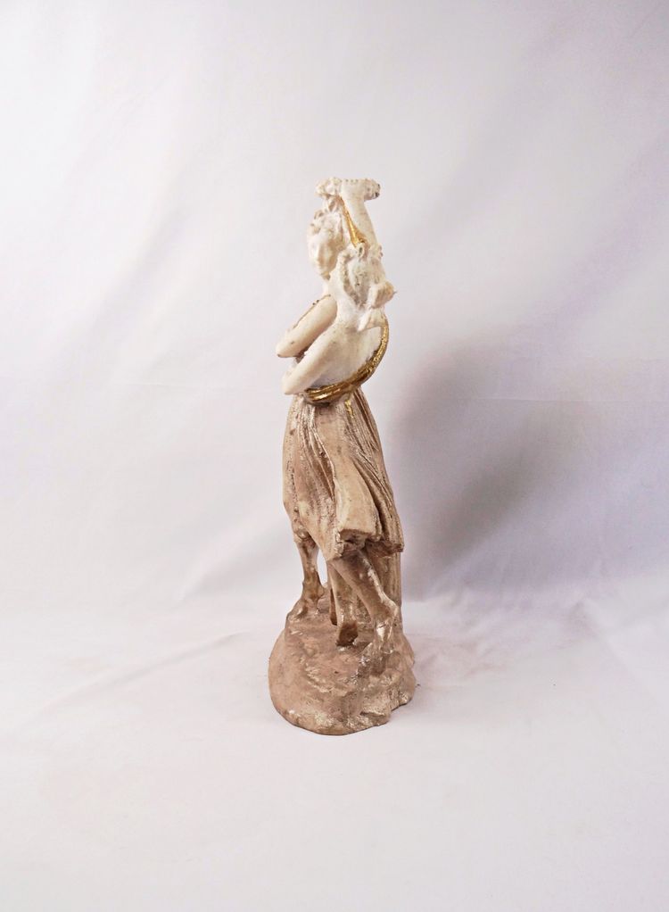 Sculpture titled "The Three Graces," made of white and gold resin, 20th century