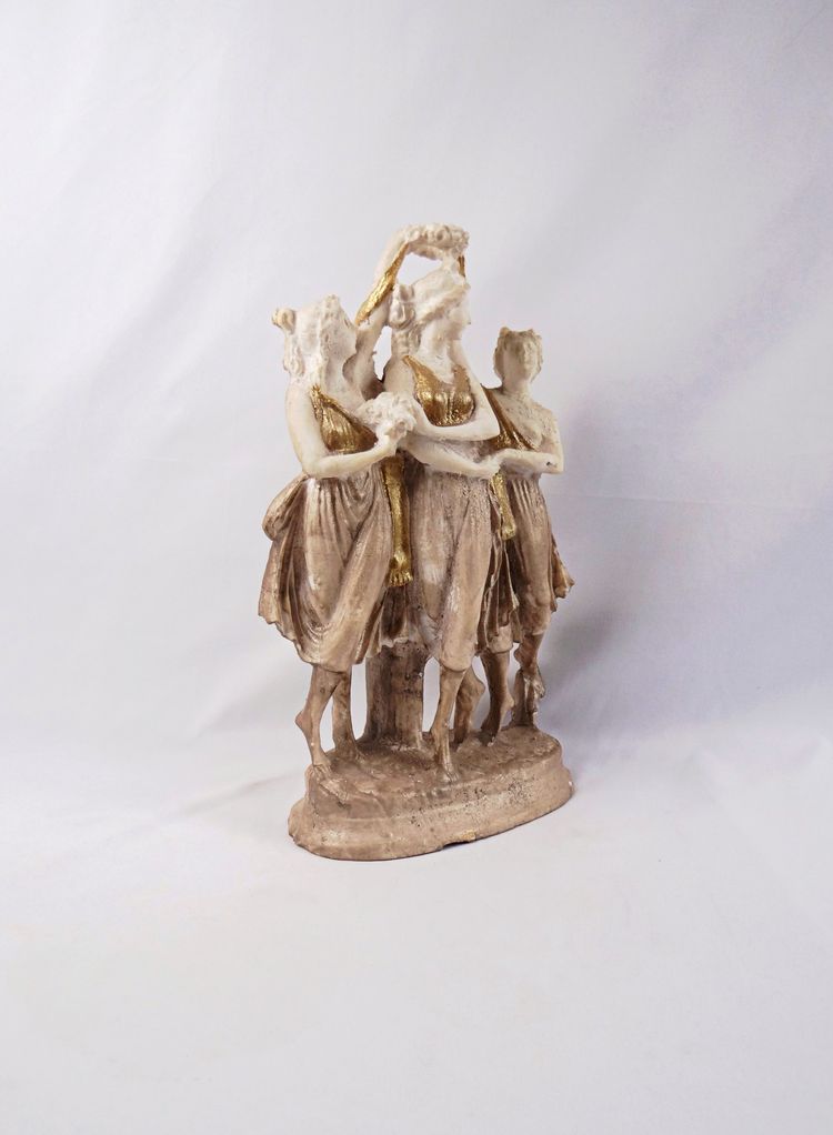Sculpture titled "The Three Graces," made of white and gold resin, 20th century