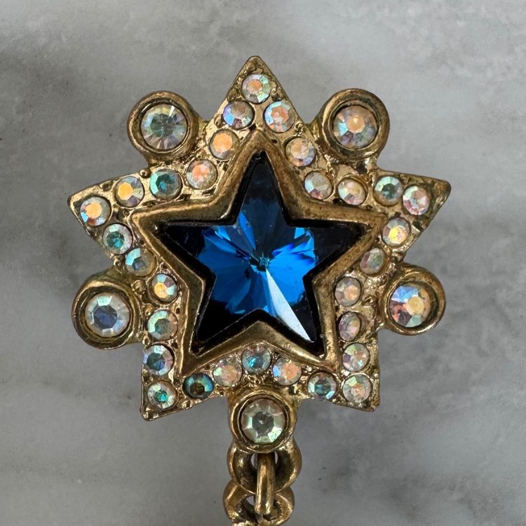 Coppia di orecchini Yves Saint Laurent a forma di stella