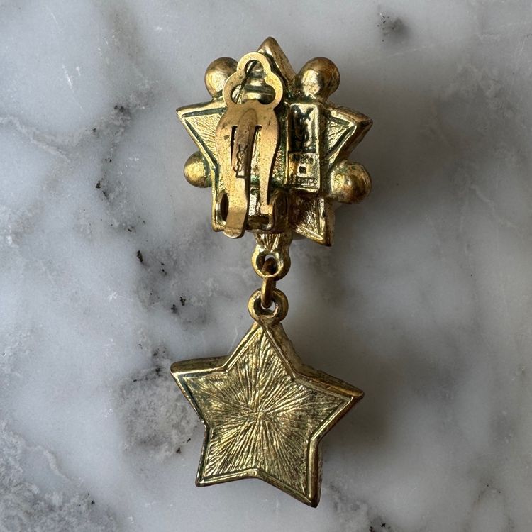 Coppia di orecchini Yves Saint Laurent a forma di stella