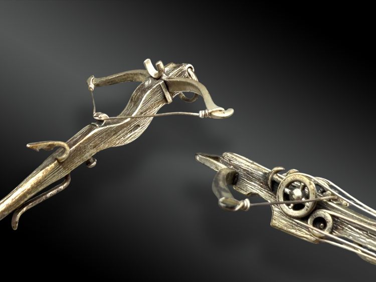BOX CONTAINING TWO MINIATURE SILVER CROSSBARKS