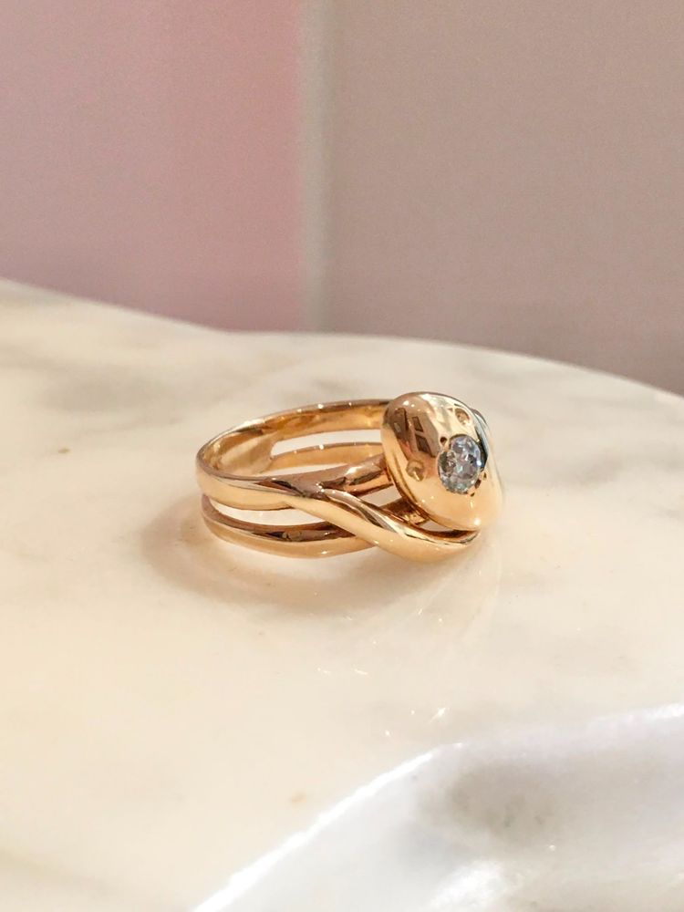 Vintage 18K yellow gold snake ring with a diamond