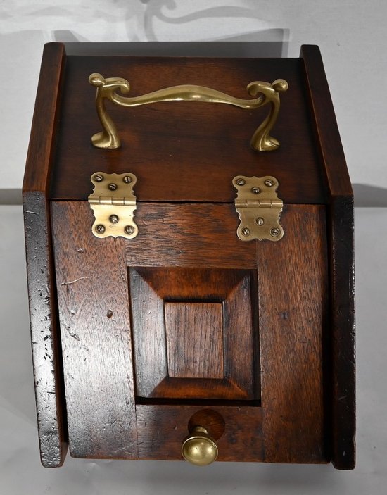 Small coal reserve in solid oak, England - 1900