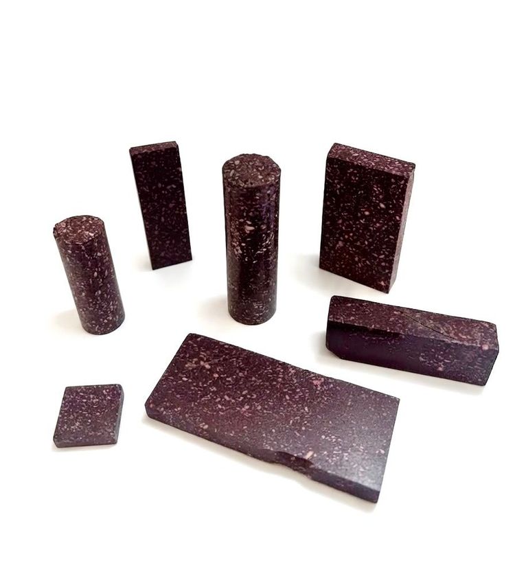 Set of 7 small bases and plaques in imperial Egyptian porphyry