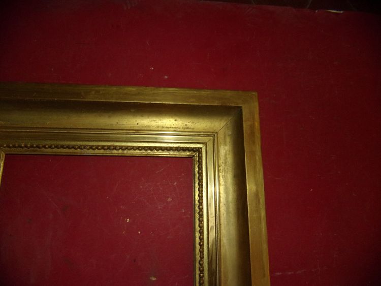 Coppia di cornici del XIX secolo in legno dorato.