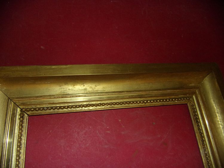 Coppia di cornici del XIX secolo in legno dorato.