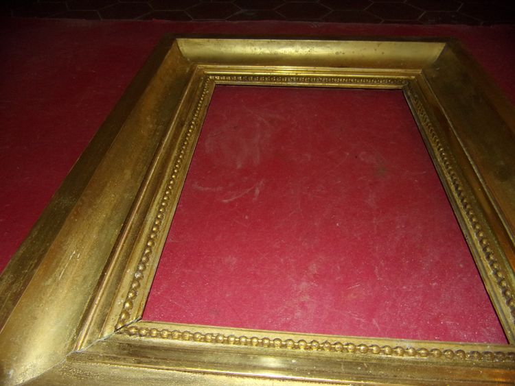 Coppia di cornici del XIX secolo in legno dorato.