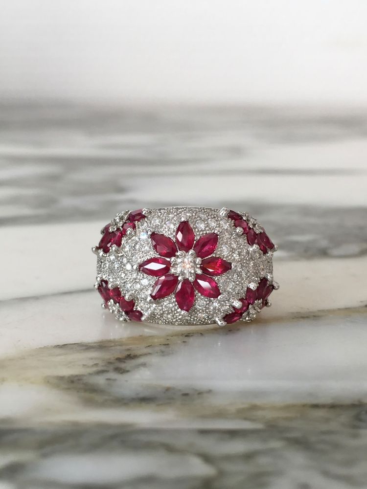 Important 18K white gold dome ring with rubies and diamonds