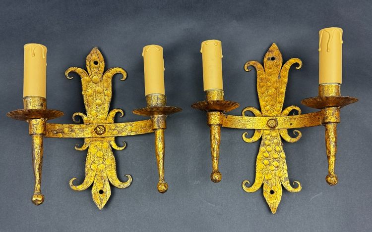 Pair of gilded wrought-iron Gothic wall sconces with built-in lighting