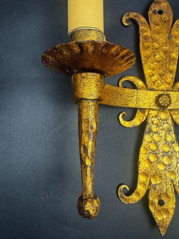 Pair of gilded wrought-iron Gothic wall sconces with built-in lighting