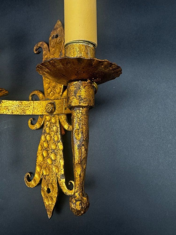 Pair of gilded wrought-iron Gothic wall sconces with built-in lighting