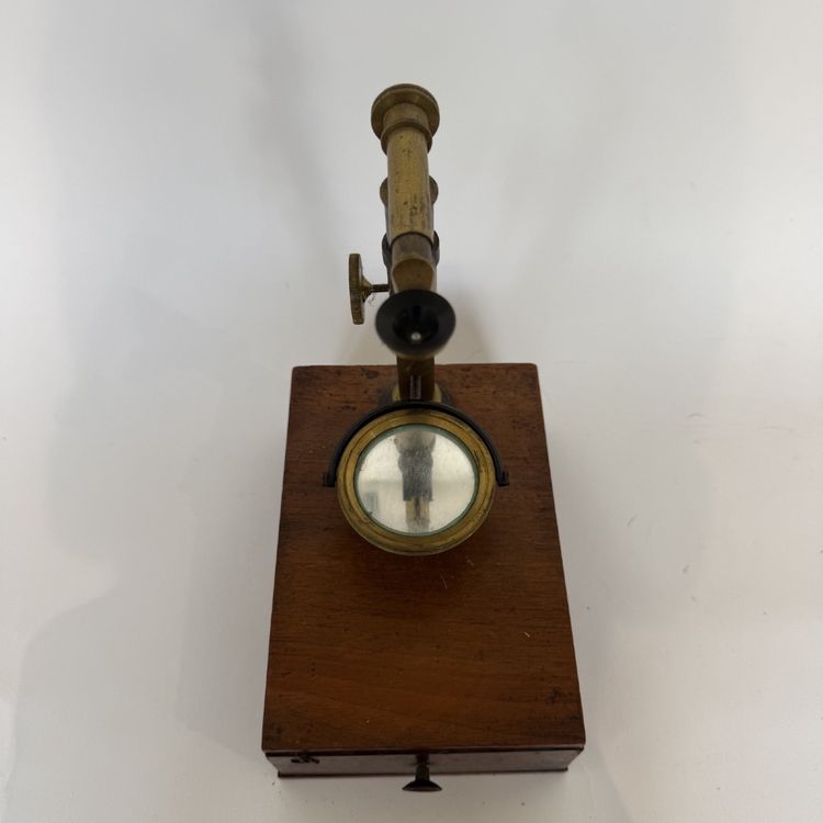 Antique brass microscope on a mahogany case, 19th century