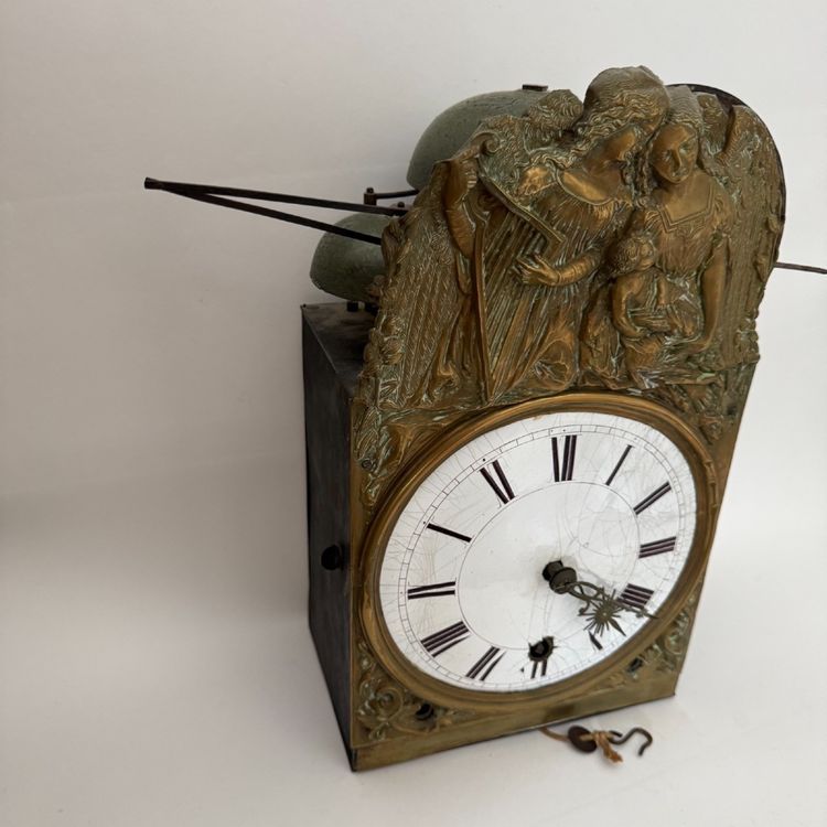 Comtoise clock movement with three bells and a brass pediment