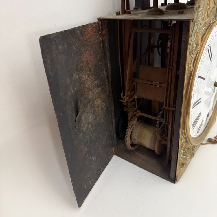 Comtoise clock movement with three bells and a brass pediment