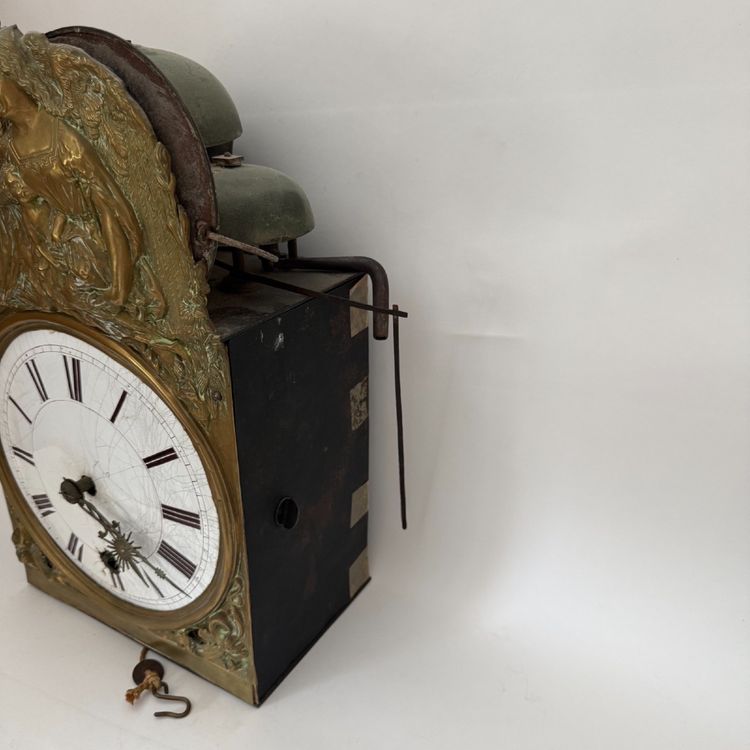Comtoise clock movement with three bells and a brass pediment