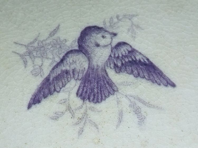 GIEN CUP on a Flat Footed Antique Faience Cookie Plate with Floral and Purple Bird Motif, "LISERONS" Model