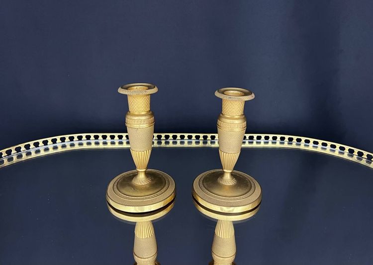 Pair of gilded brass candlesticks, Empire style