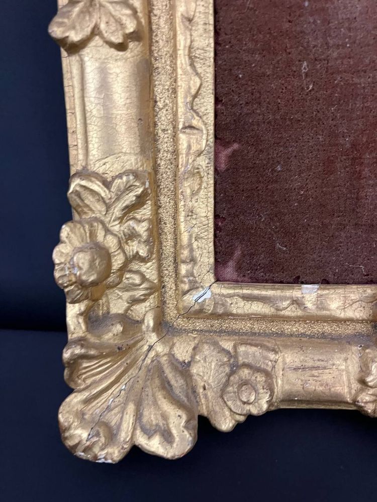 Antique carved and gilded wooden frame with floral decoration