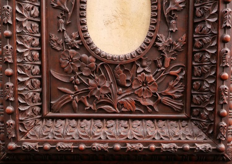 Richly carved, stained fruitwood oval picture frame, 19th century