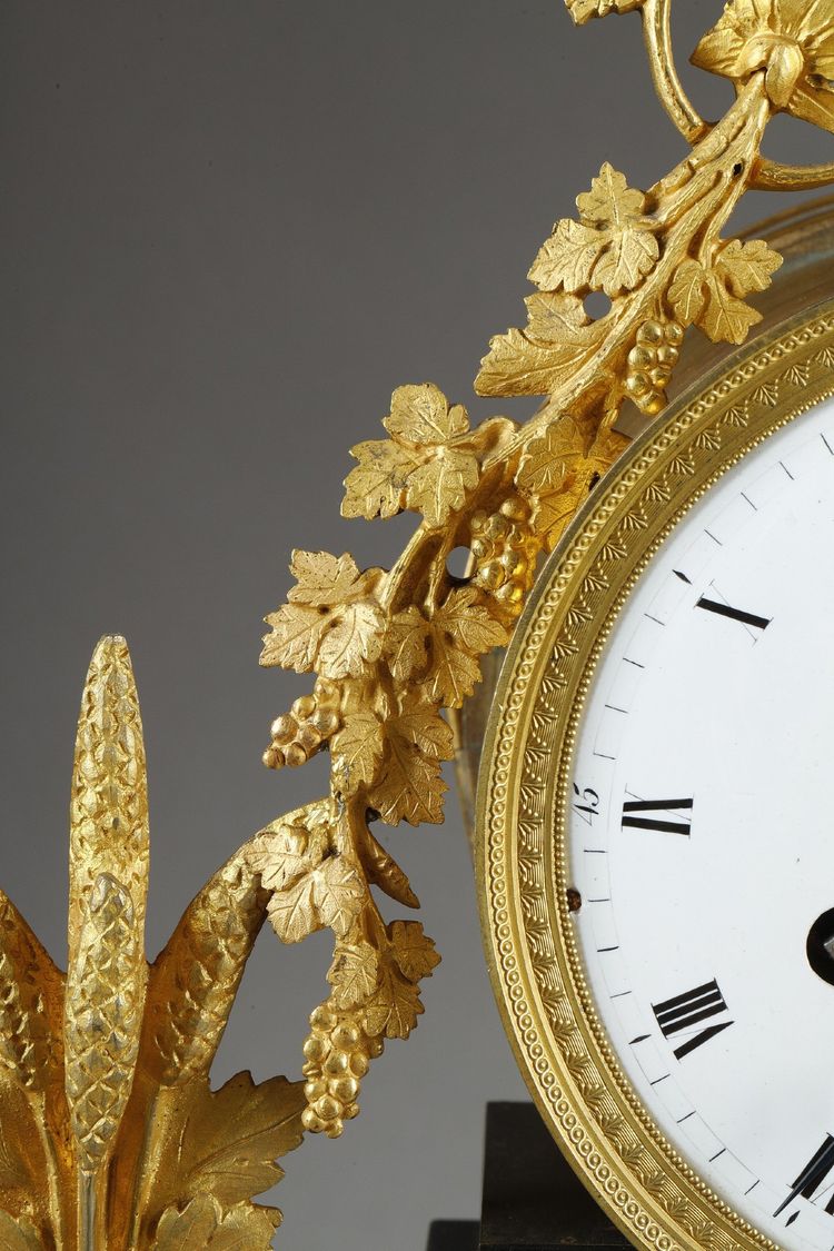 LARGE DIRECTOIRE CLOCK IN PATINATED AND GILT BRONZE
