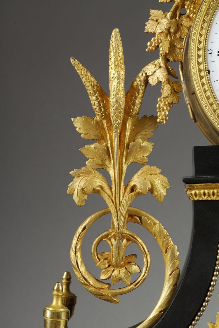 LARGE DIRECTOIRE CLOCK IN PATINATED AND GILT BRONZE