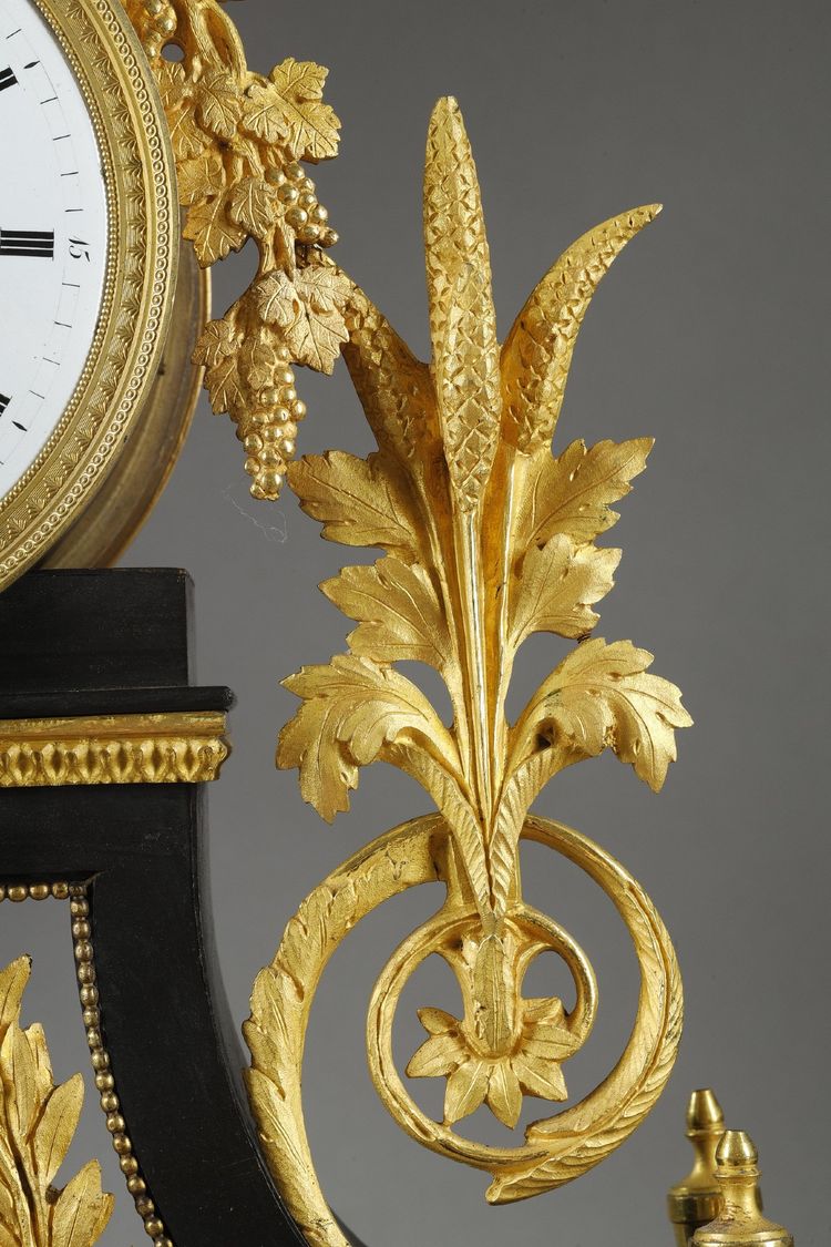 LARGE DIRECTOIRE CLOCK IN PATINATED AND GILT BRONZE