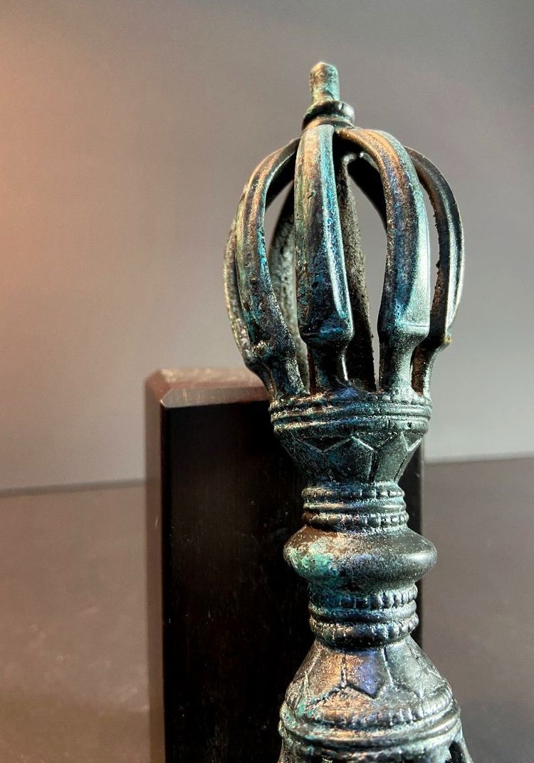 Tibet, Late 19th Century, oblong 9-pointed bronze vajra.