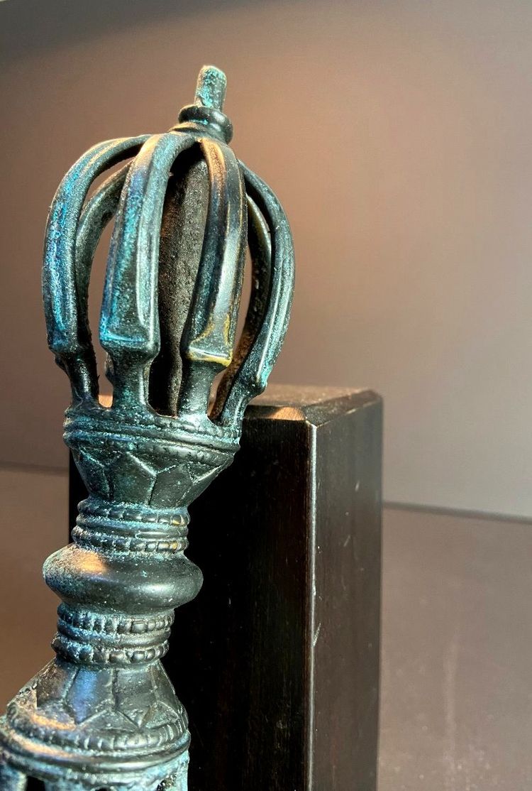 Tibet, Late 19th Century, oblong 9-pointed bronze vajra.