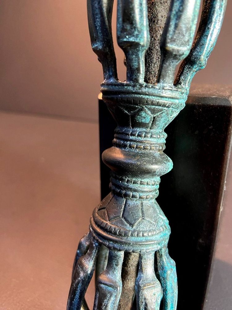 Tibet, Late 19th Century, oblong 9-pointed bronze vajra.