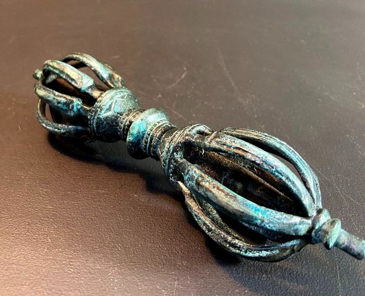 Tibet, Late 19th Century, oblong 9-pointed bronze vajra.