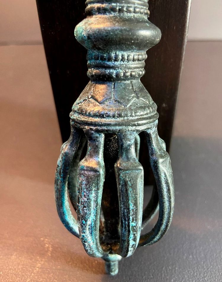 Tibet, Late 19th Century, oblong 9-pointed bronze vajra.