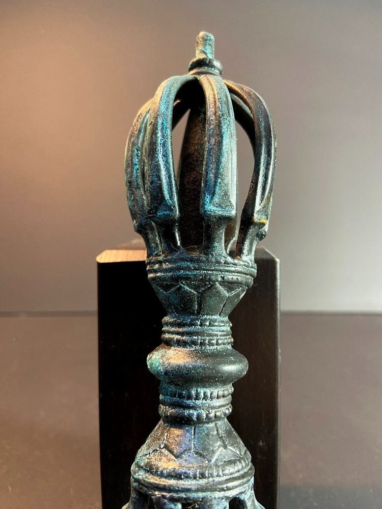 Tibet, Late 19th Century, oblong 9-pointed bronze vajra.