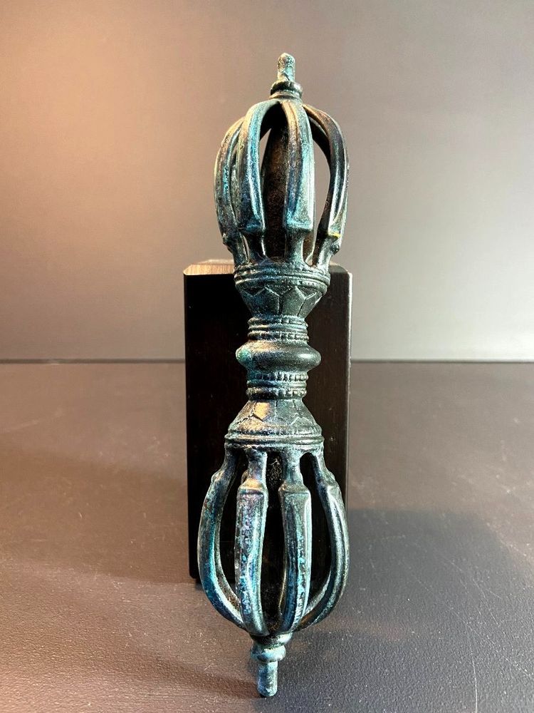Tibet, Late 19th Century, oblong 9-pointed bronze vajra.