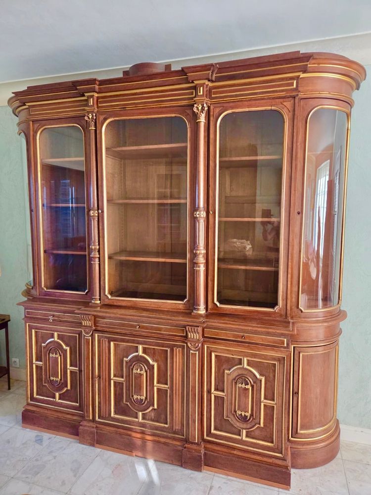 Light walnut bookcase with arched doors