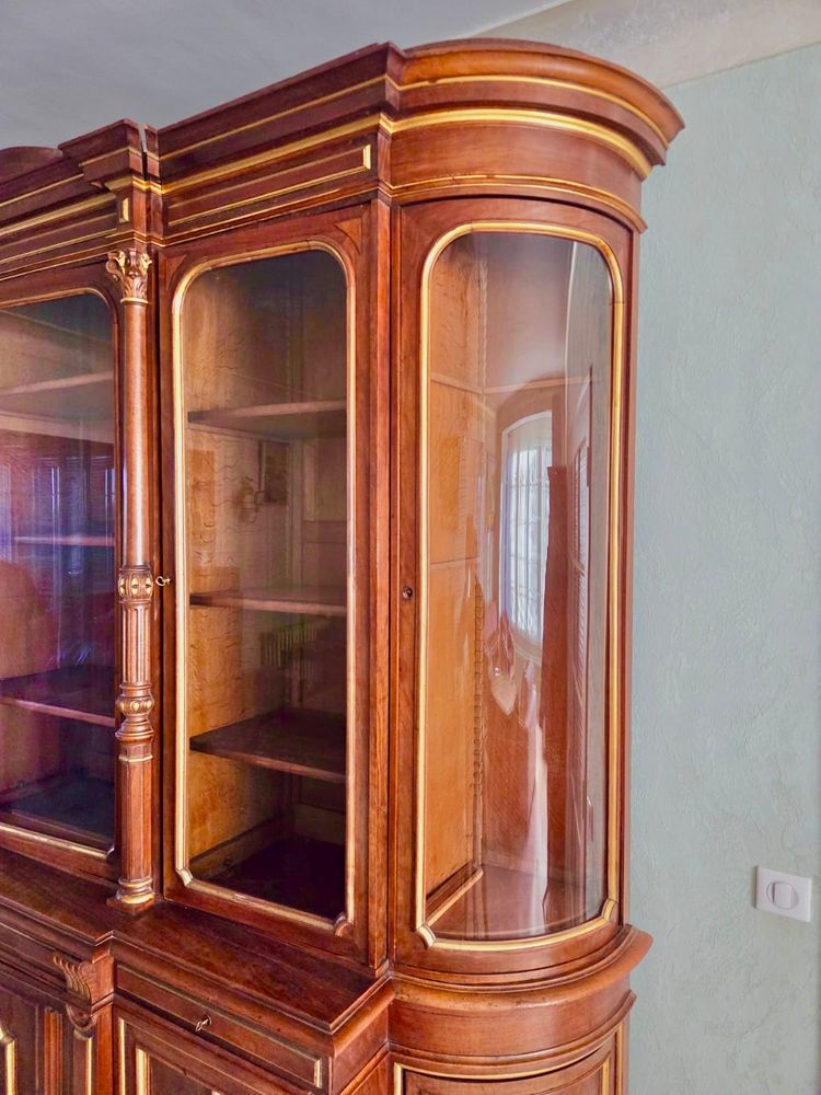 Light walnut bookcase with arched doors