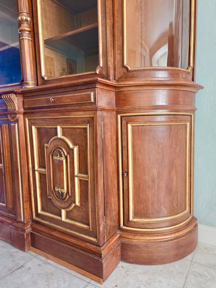 Light walnut bookcase with arched doors