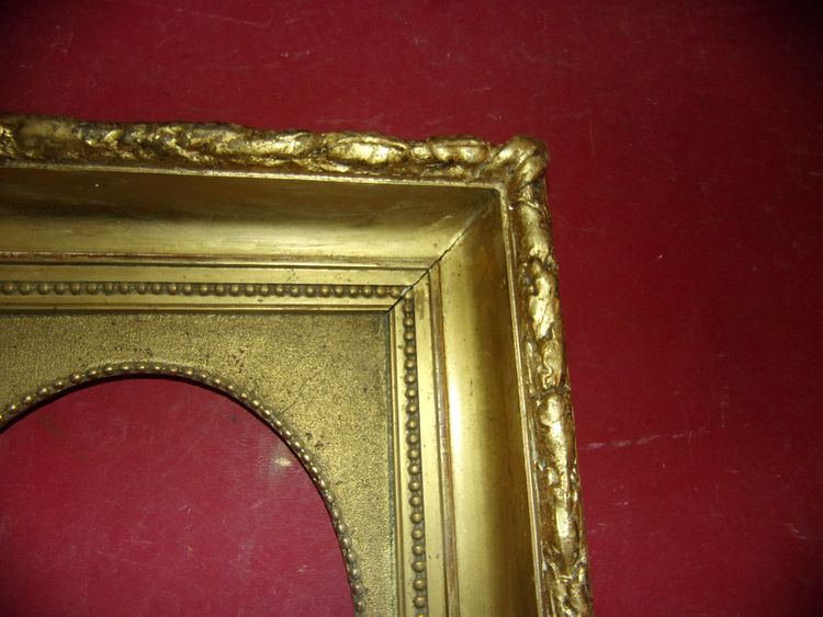 19th-century frame, in gilded wood.