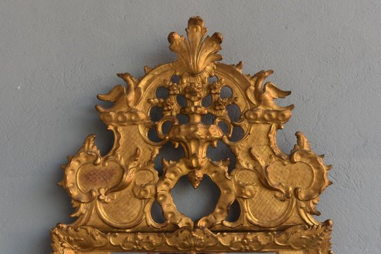 Specchio grande con pare vicino Luigi XIV "La diciottesima volta in legno dorato"