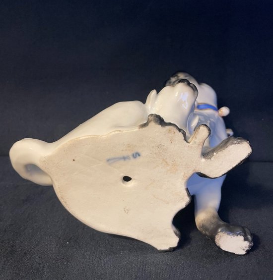 Pug and her little one in porcelain. Samson after Meissen
