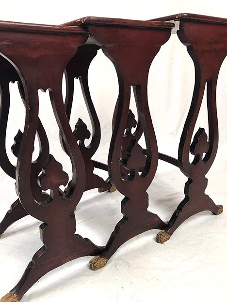 Set of three red lacquered nesting tables with gold decoration in the Asian style, 19th century
