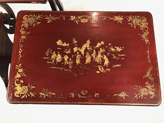 Set of three red lacquered nesting tables with gold decoration in the Asian style, 19th century
