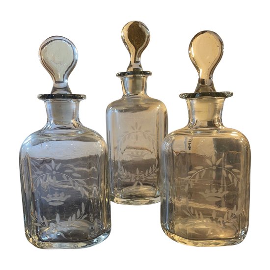 Three engraved glass bottles 19th century