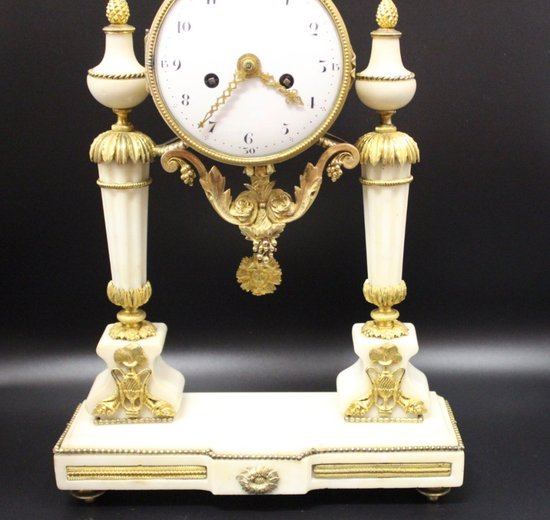 Late Louis XVI Period Portico Clock In Marble And Gilt Bronze