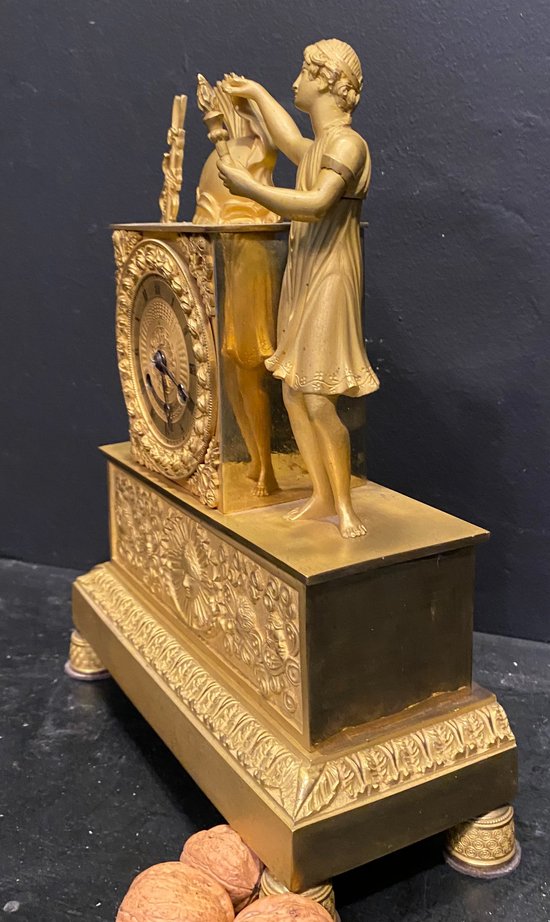 Empire clock in gilded bronze