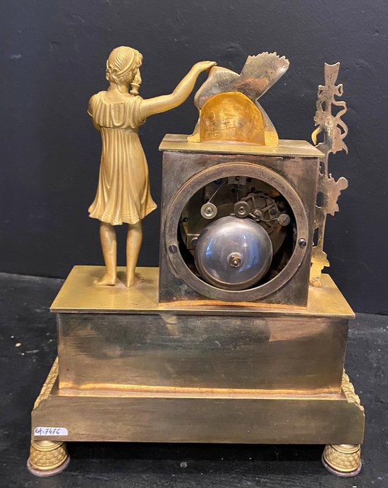 Empire clock in gilded bronze