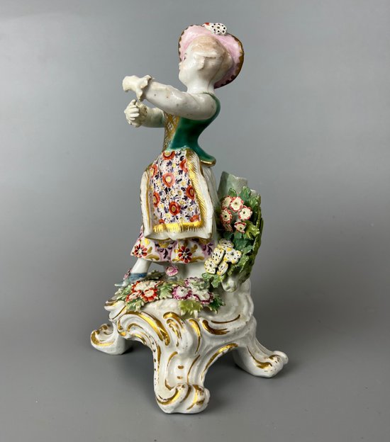 A mid 18thc Bow "New Dancers" figure on a rococo footed base 1756-65