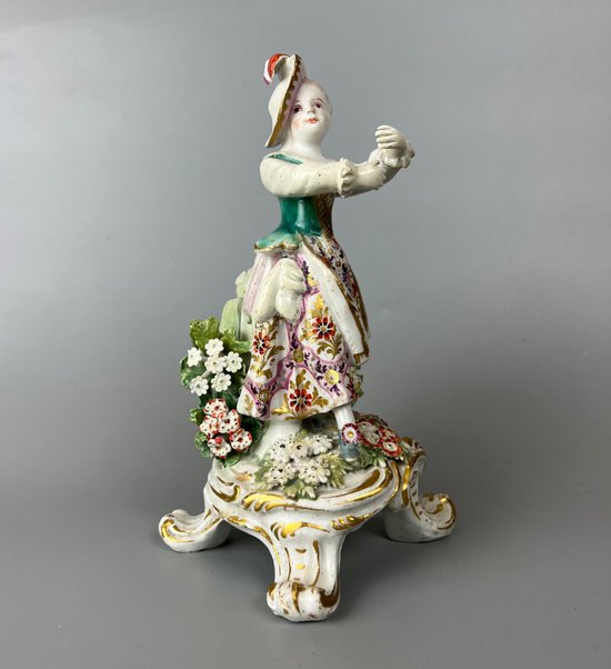 A mid 18thc Bow "New Dancers" figure on a rococo footed base 1756-65